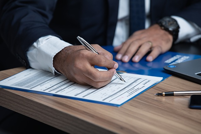 man signing divorce contract