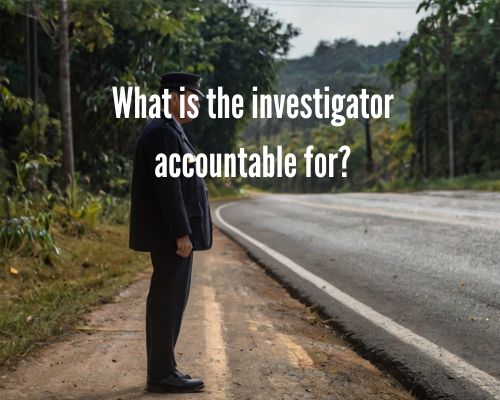 an investigator beside the road