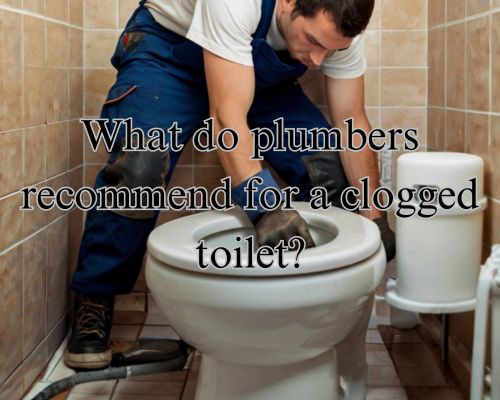 plumber working on unclogging toilet